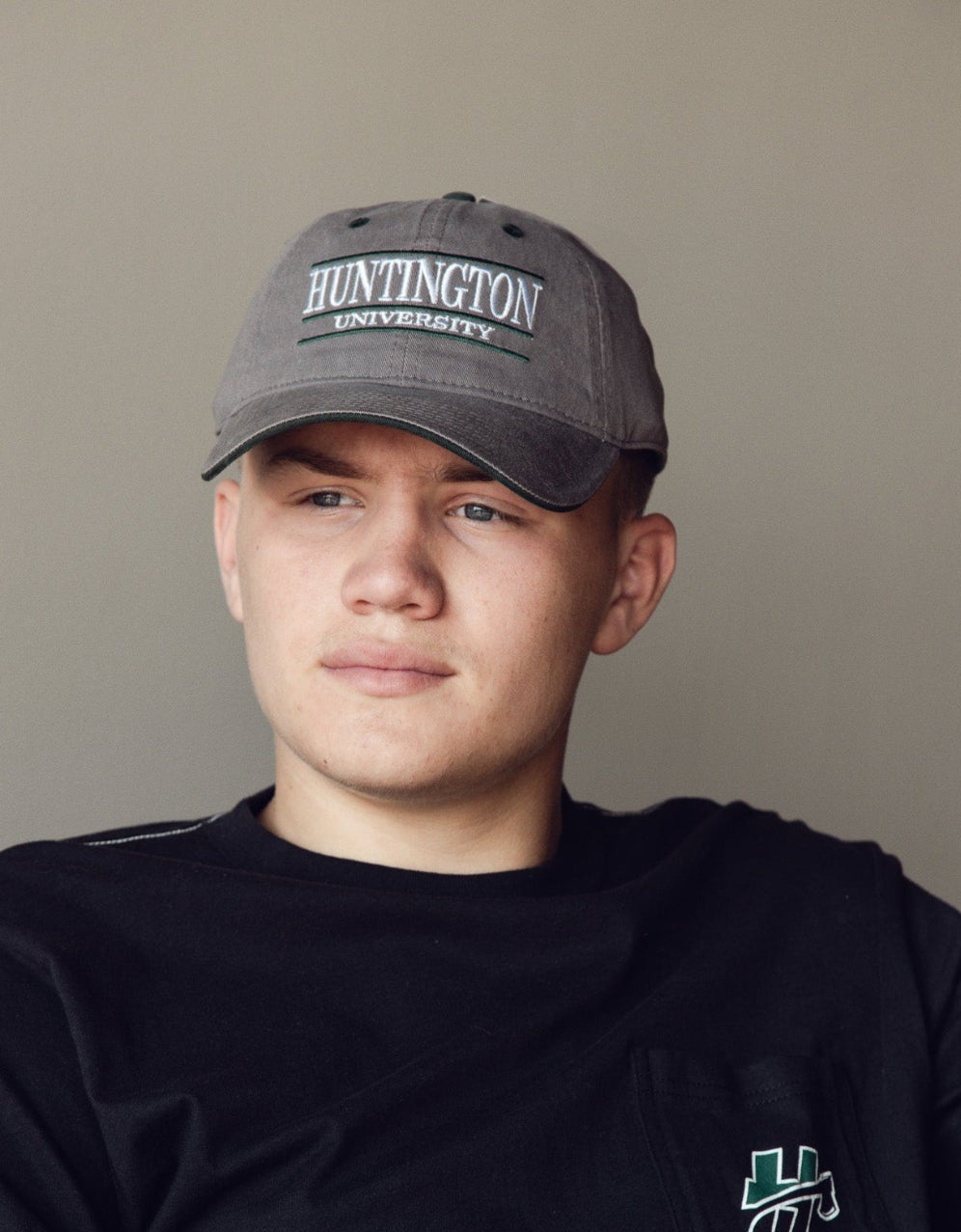 Man posing wearing a baseball cap